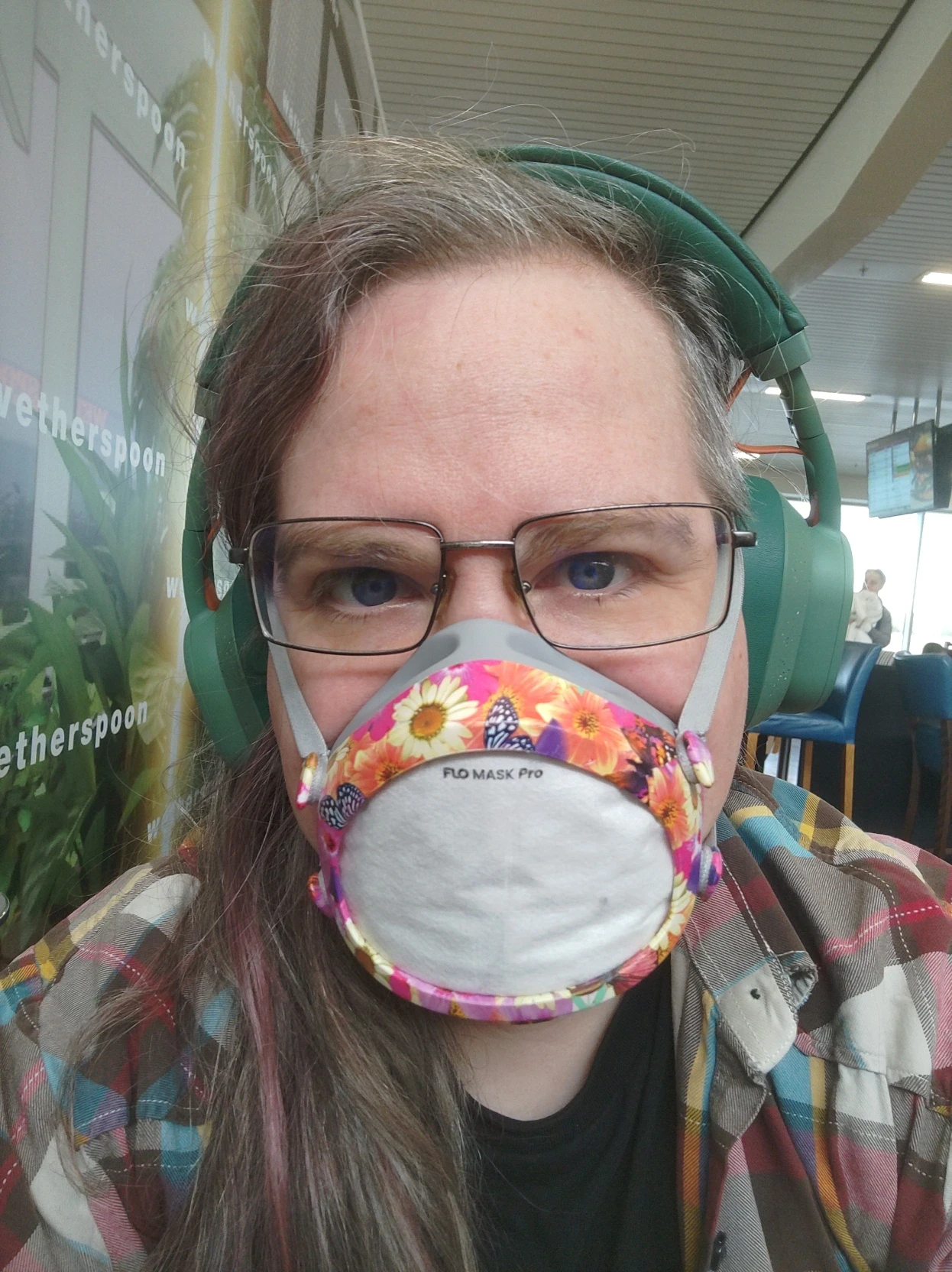 Me wearing a Flo Mask and headphones